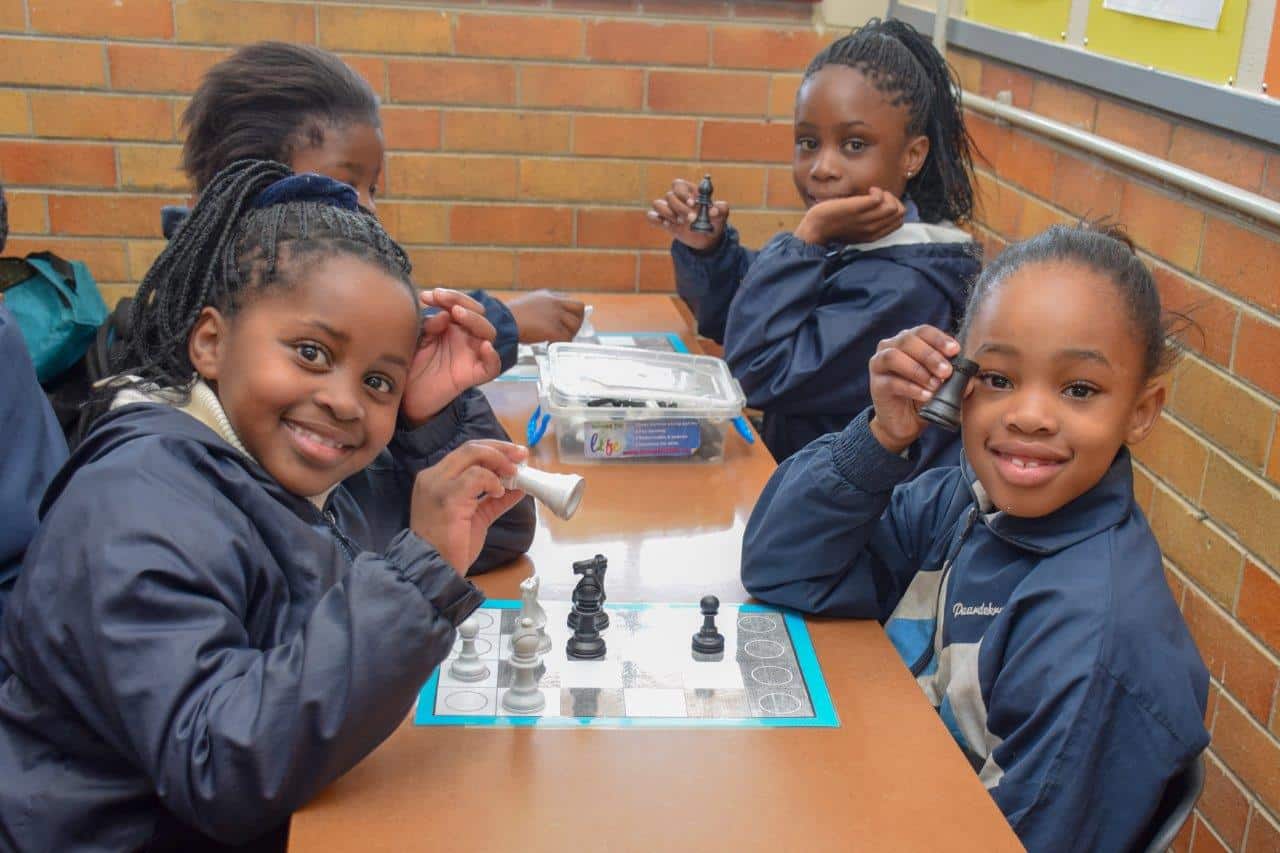 Grade 3 learners playing chess at Hartzstraat Primary